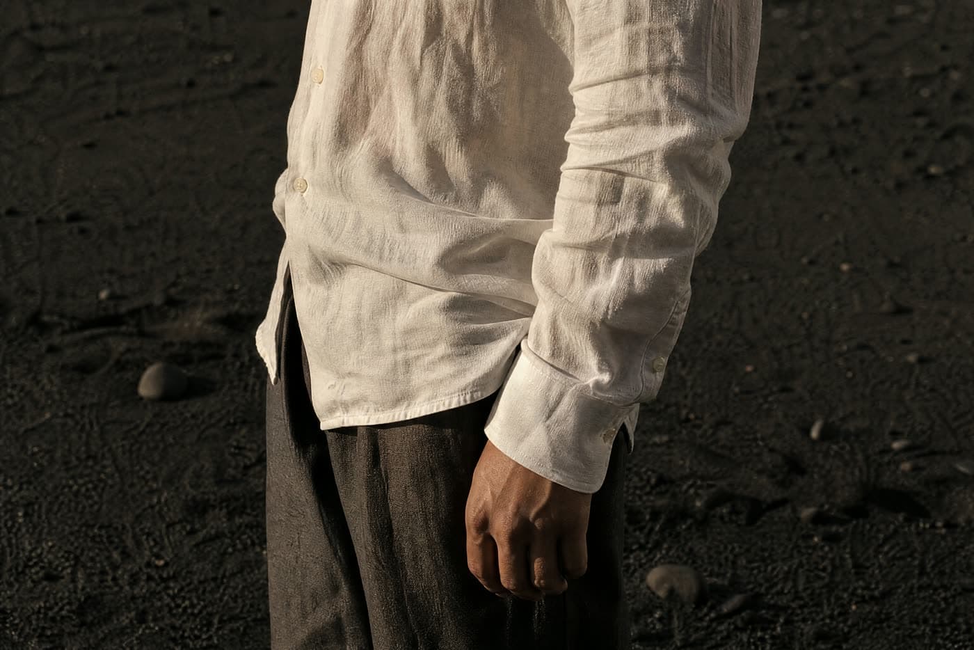 The same cloth after a full day of wear, creased at the elbow and the waist, unpressed.